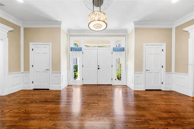 a bathroom with a granite countertop sink a mirror and a shower