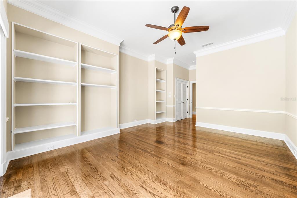 133 Osprey Point Drive Osprey, FL 34229 - Photo 44 of 99 a view of room with wooden floor and ceiling fan