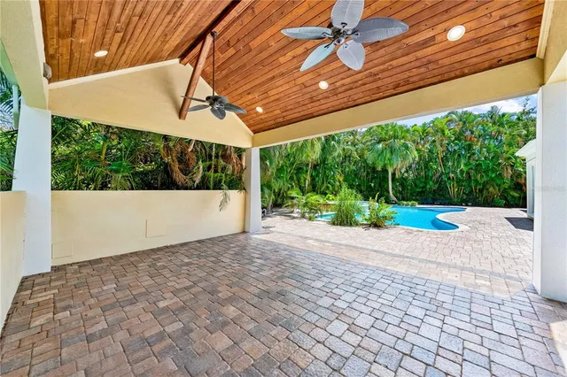 a view of a house with a yard table and chairs