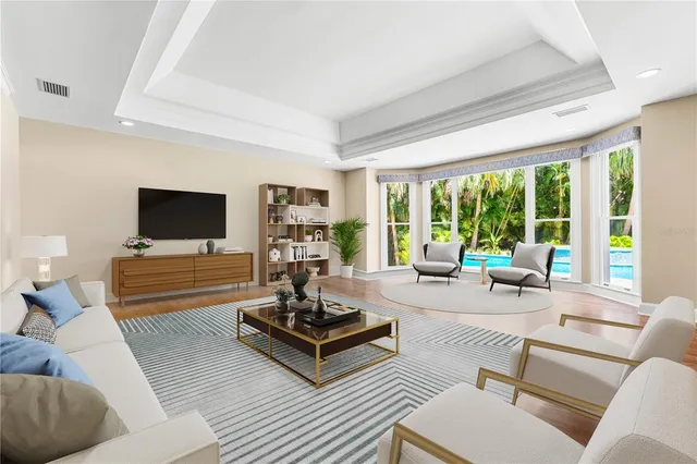 a view of a workspace with furniture and a book shelf