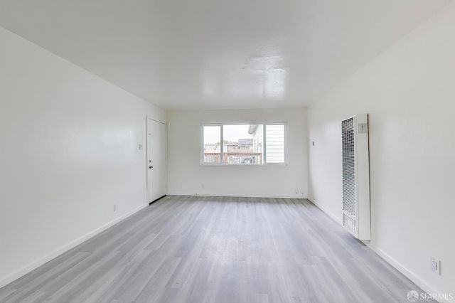 a kitchen with stainless steel appliances granite countertop a stove a refrigerator and a sink