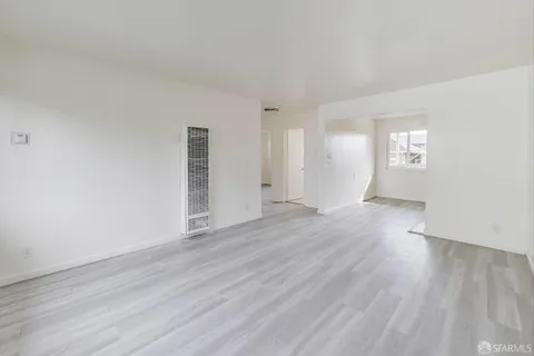 a kitchen with cabinets and appliances
