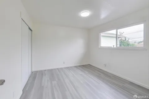 a view of balcony with wooden floor