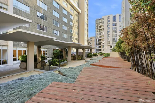 a view of a building with sitting area