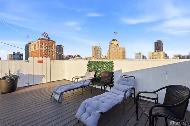 a bedroom with furniture and a wooden floor