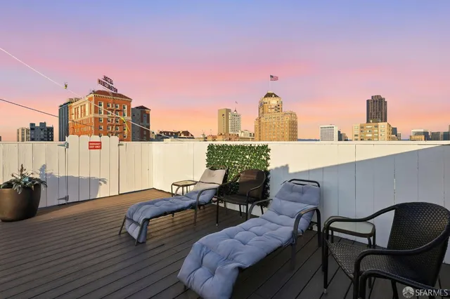 a view of a terrace with furniture and stove