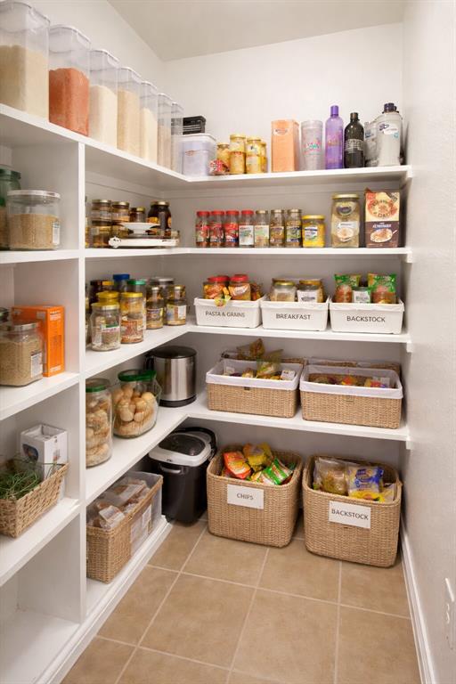 9754 Boyton Canyon Road Frisco, TX 75035 - Photo 14 of 21 a kitchen with a lot of different kinds of food