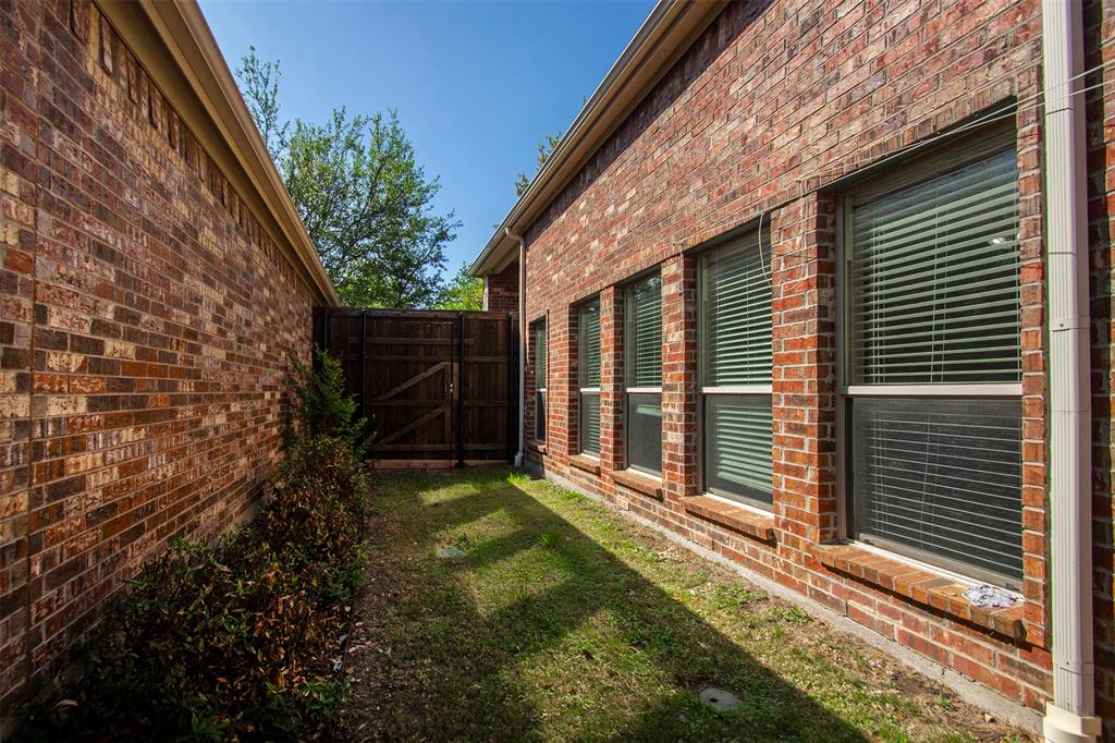 9754 Boyton Canyon Road Frisco, TX 75035 - Photo 19 of 21 a view of a backyard with a large tree