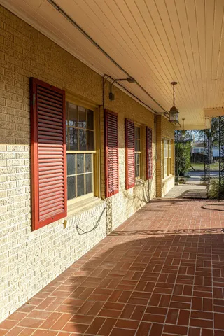 a view of a brick house with a large window