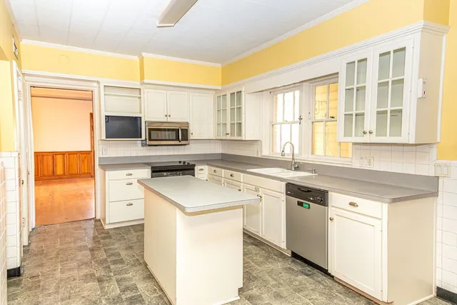 a kitchen with a sink stove and refrigerator