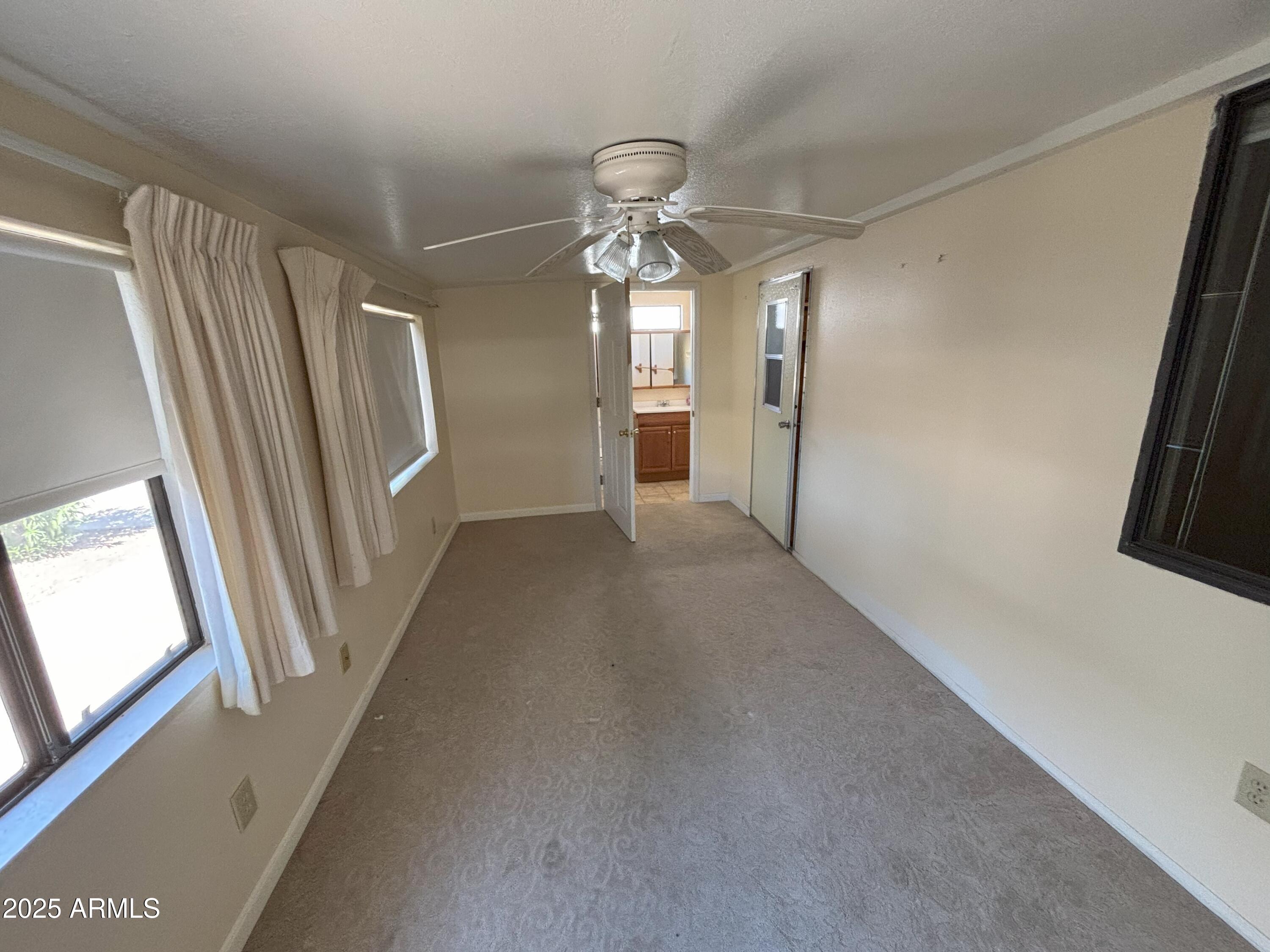 17200 West Bell Road, Unit 2195 Surprise, AZ 85374 - Photo 14 of 16 a view of a livingroom with wooden floor and staircase