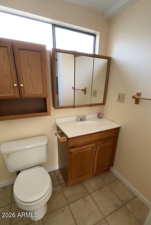 17200 West Bell Road, Unit 2195 Surprise, AZ 85374 - Photo 17 of 27 a bathroom with a toilet sink and mirror