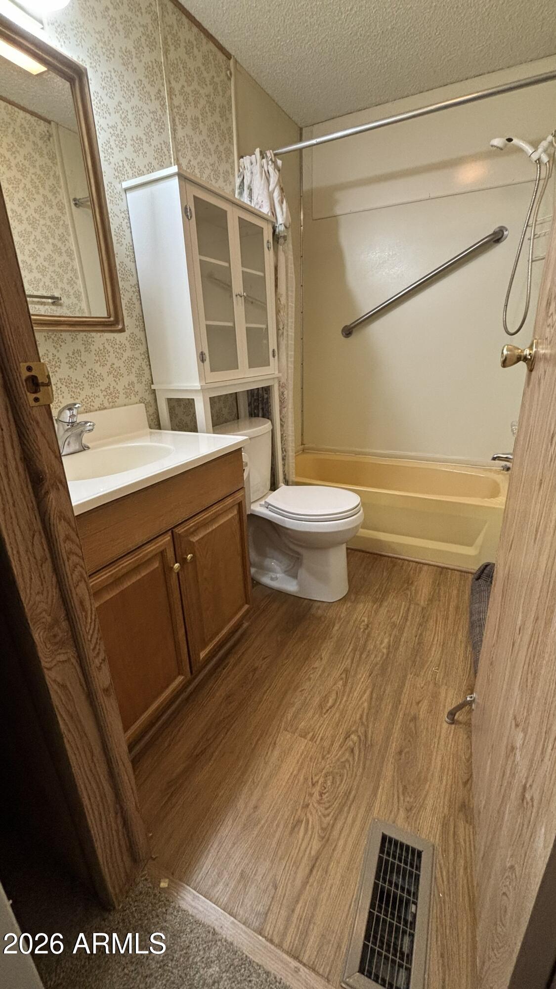17200 West Bell Road, Unit 2195 Surprise, AZ 85374 - Photo 20 of 27 a bathroom with a sink and a mirror