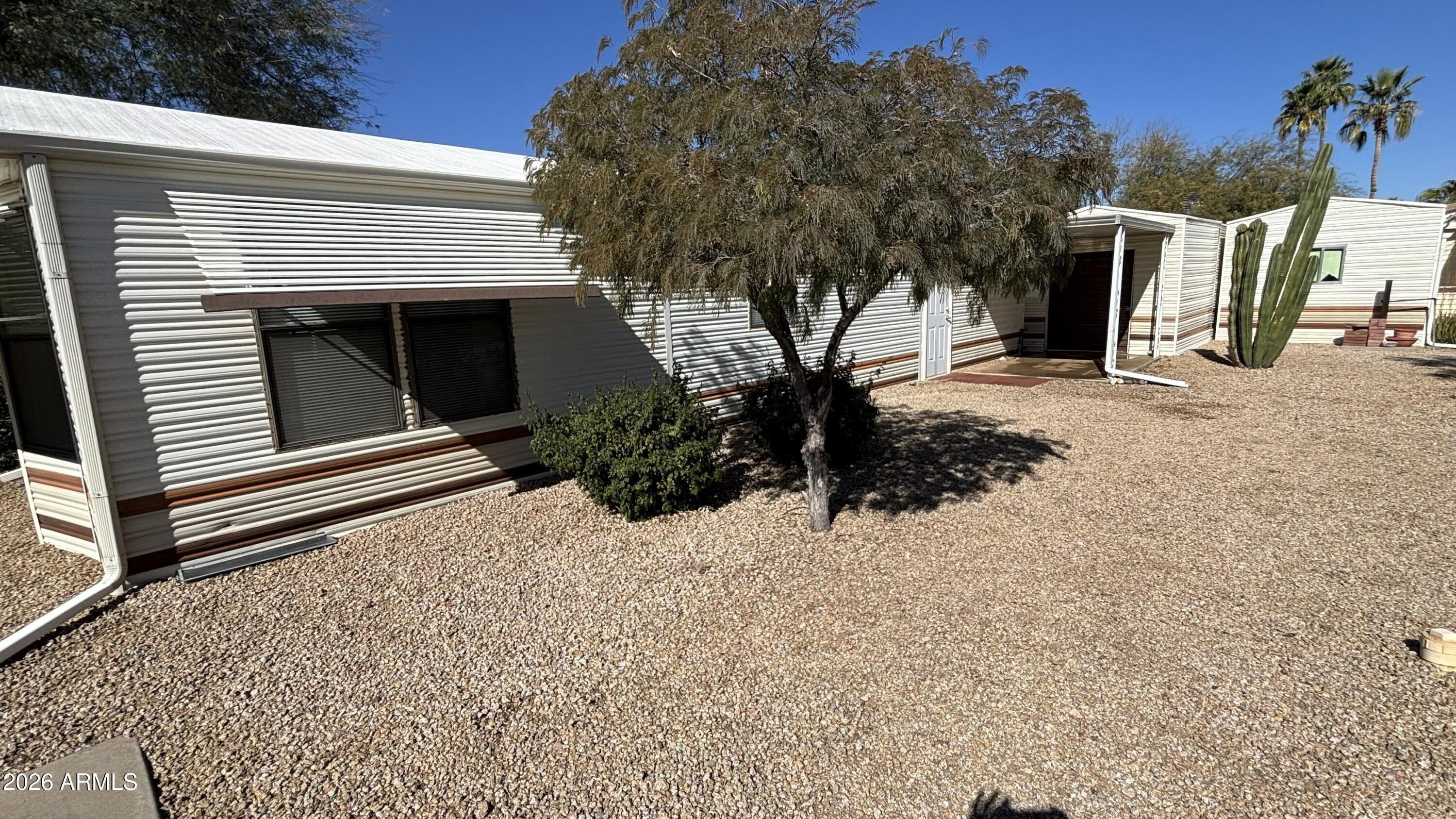 17200 West Bell Road, Unit 2195 Surprise, AZ 85374 - Photo 4 of 27 a front view of a house with a yard
