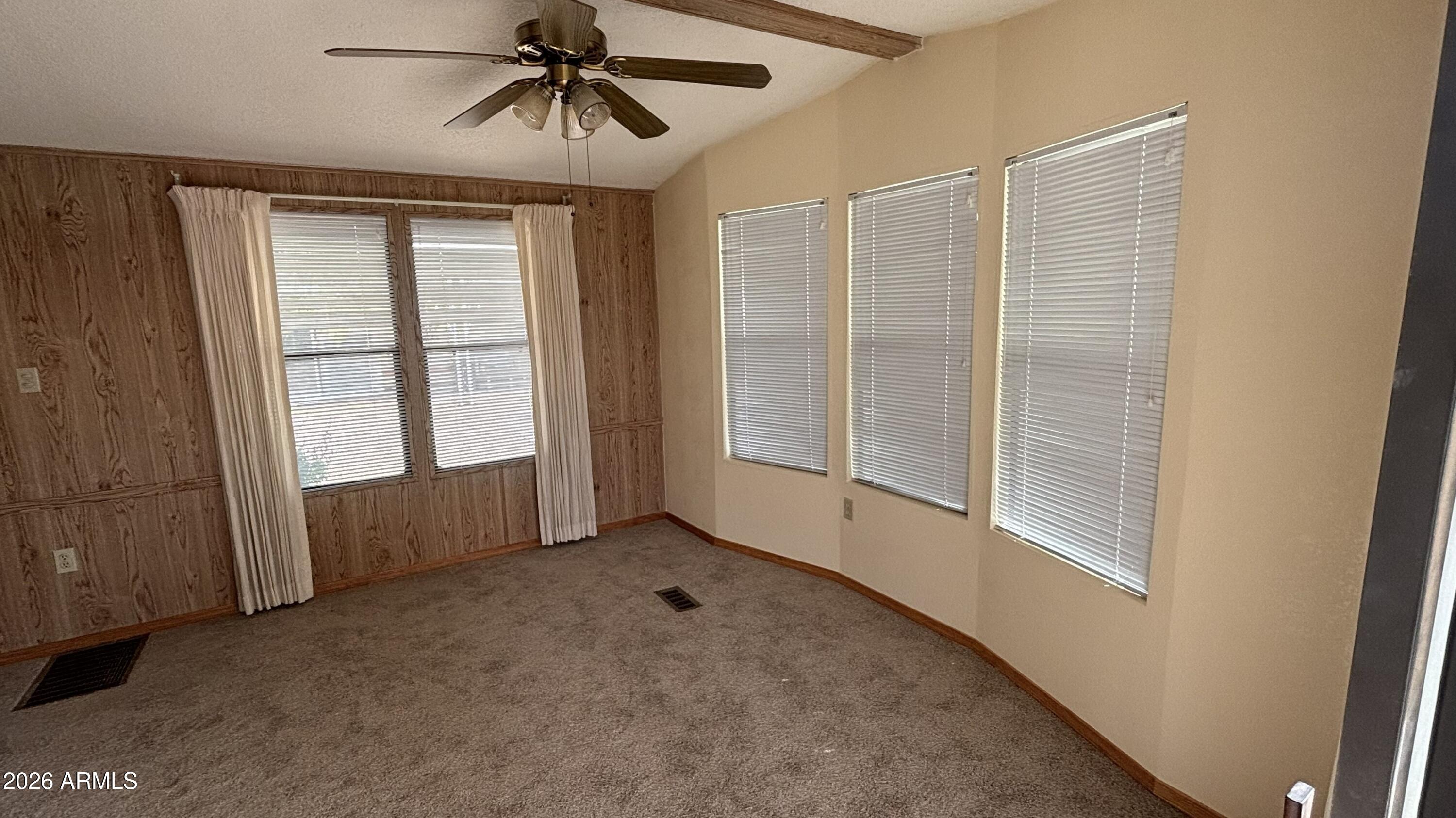 17200 West Bell Road, Unit 2195 Surprise, AZ 85374 - Photo 7 of 27 a view of an empty room with a window