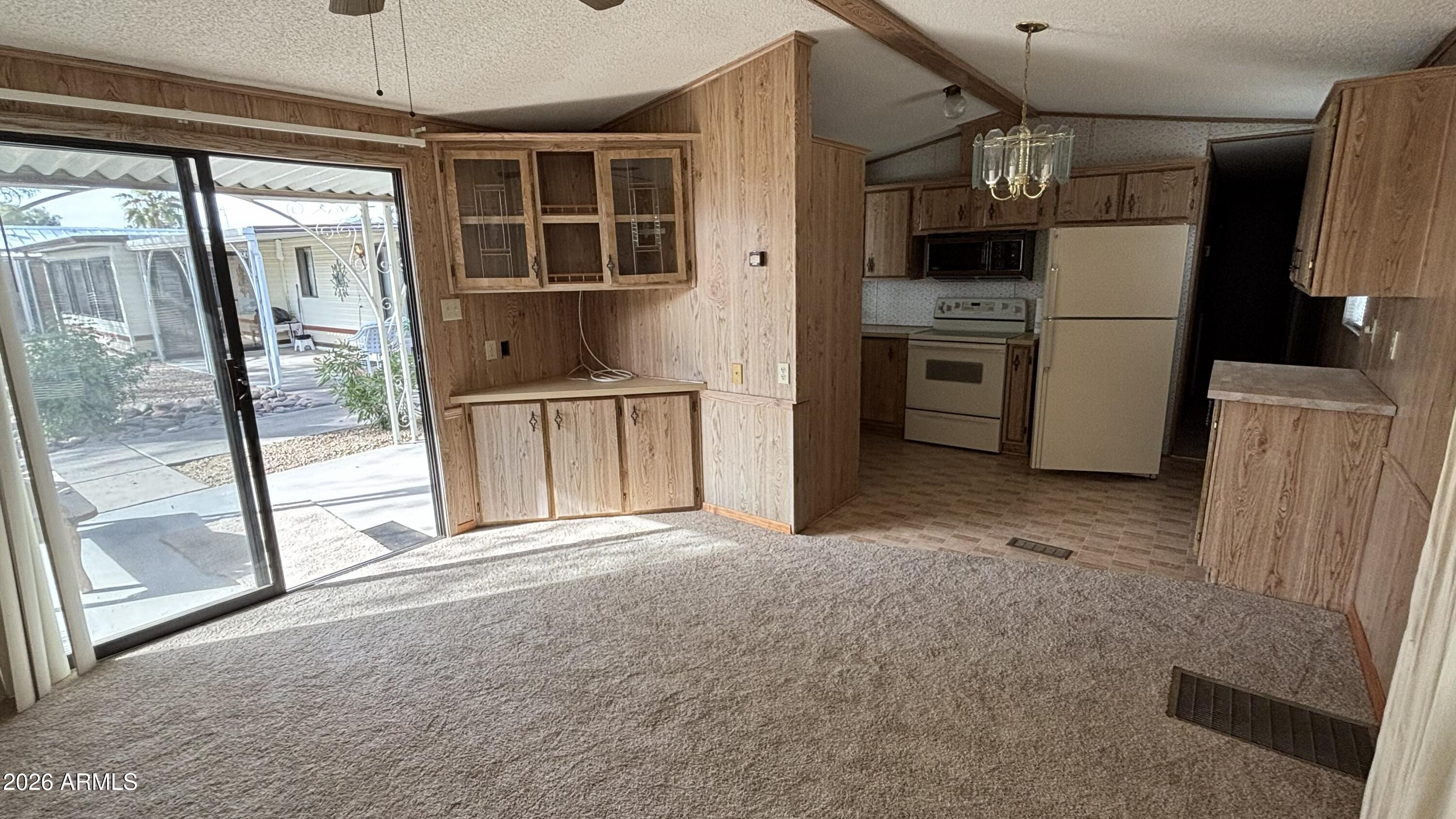 17200 West Bell Road, Unit 2195 Surprise, AZ 85374 - Photo 8 of 27 a view of a kitchen with a refrigerator and a sink