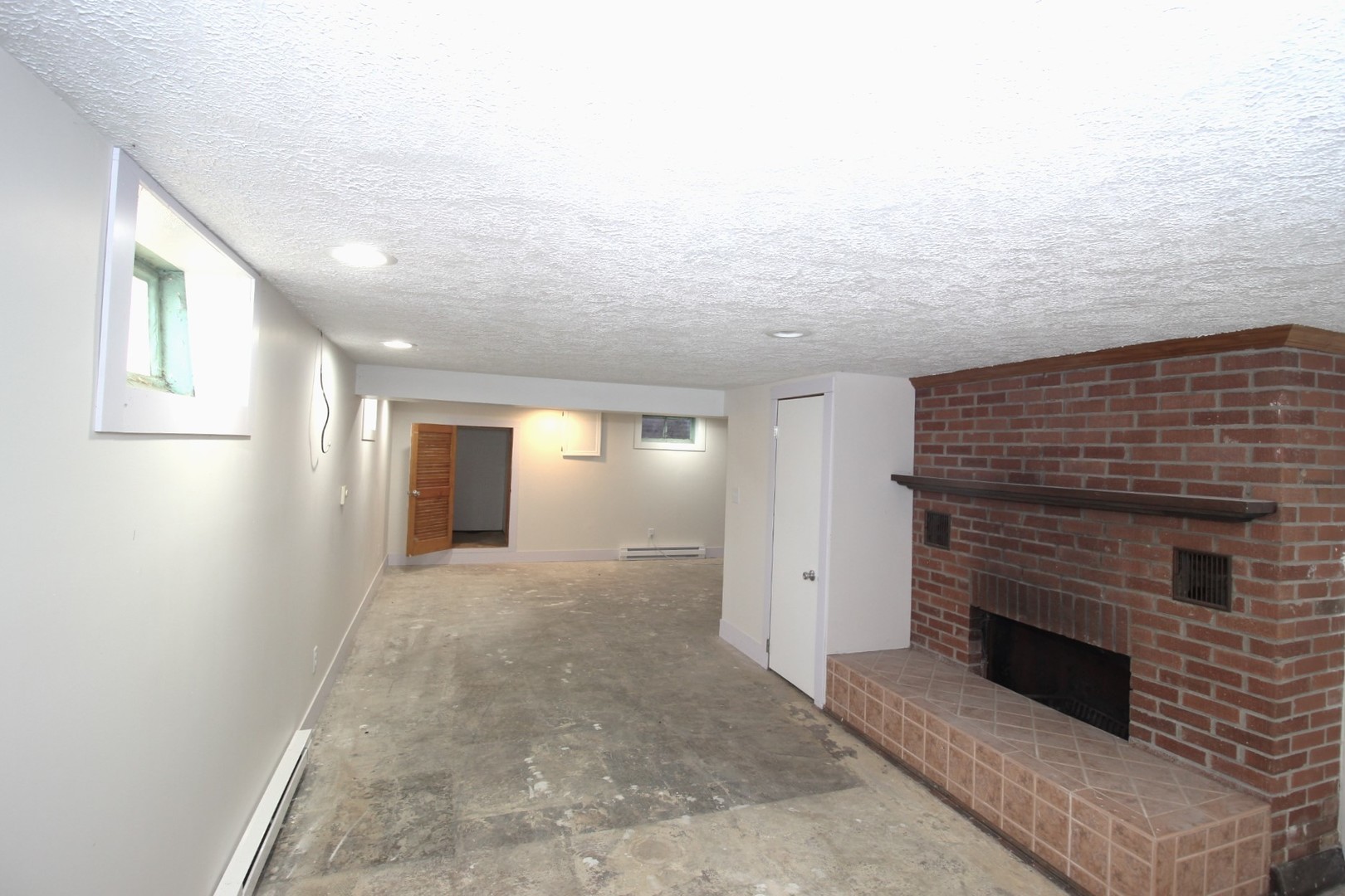 108 East Gridley Road Gridley, IL 61744 - Photo 19 of 22 a view of a livingroom with an empty space and a fireplace