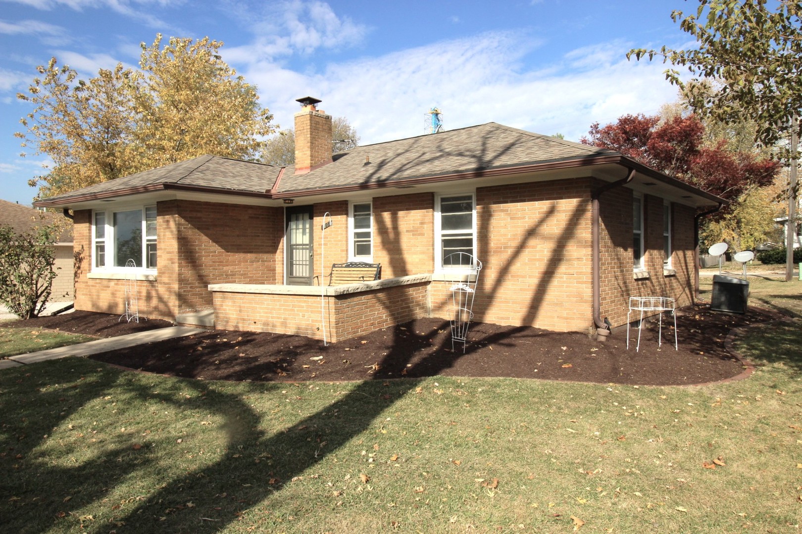 108 East Gridley Road Gridley, IL 61744 - Photo 2 of 22 a front view of a house with a yard