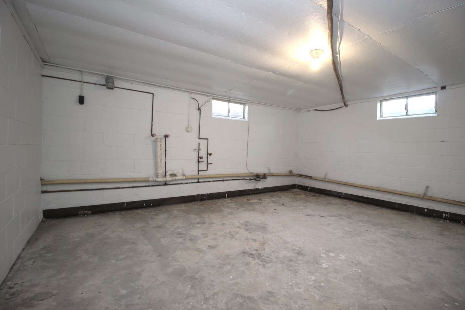 108 East Gridley Road Gridley, IL 61744 - Photo 21 of 22 an empty room with staircase