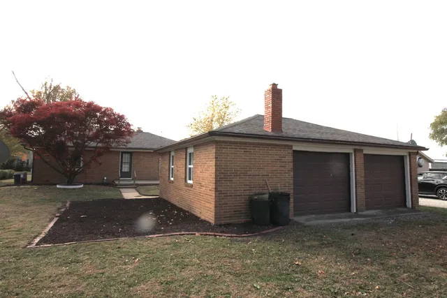 a front view of a house with yard
