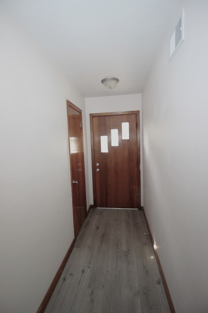 108 East Gridley Road Gridley, IL 61744 - Photo 7 of 22 a view of hallway with window