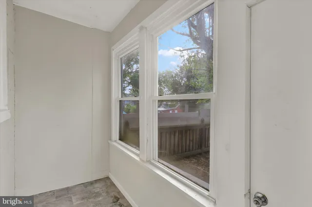 a bathroom with a glass door and a glass door