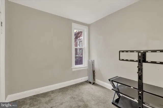 a view of empty room with windows