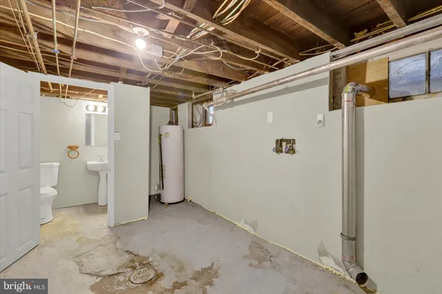 a view of a house with wooden fence
