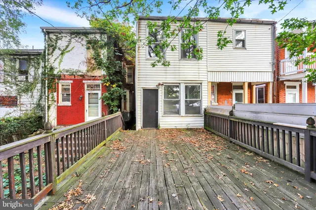 a view of a two chairs in the balcony