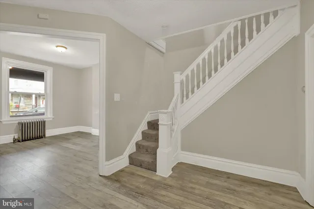 a view of entryway with wooden floor