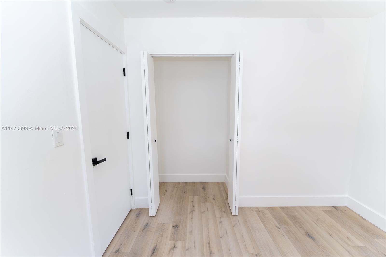10441 Southwest 50th Terrace Miami, FL 33165 - Photo 12 of 19 a view of a hallway with wooden floor
