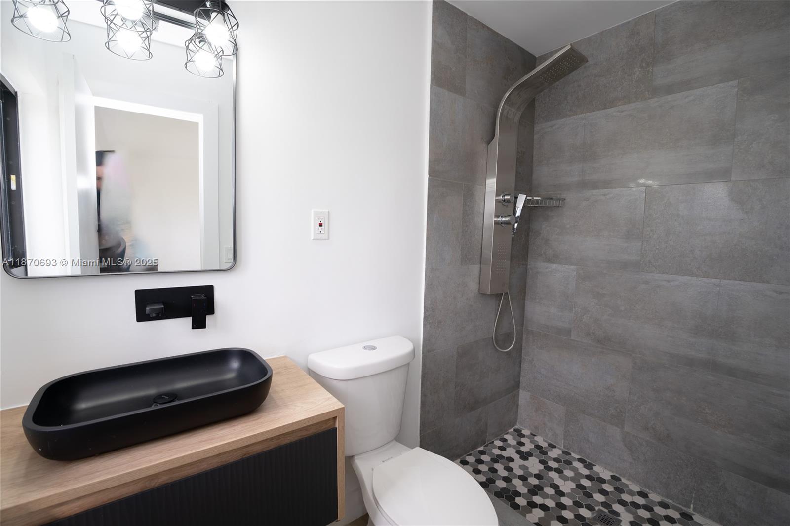 10441 Southwest 50th Terrace Miami, FL 33165 - Photo 18 of 19 a bathroom with a toilet a sink and shower