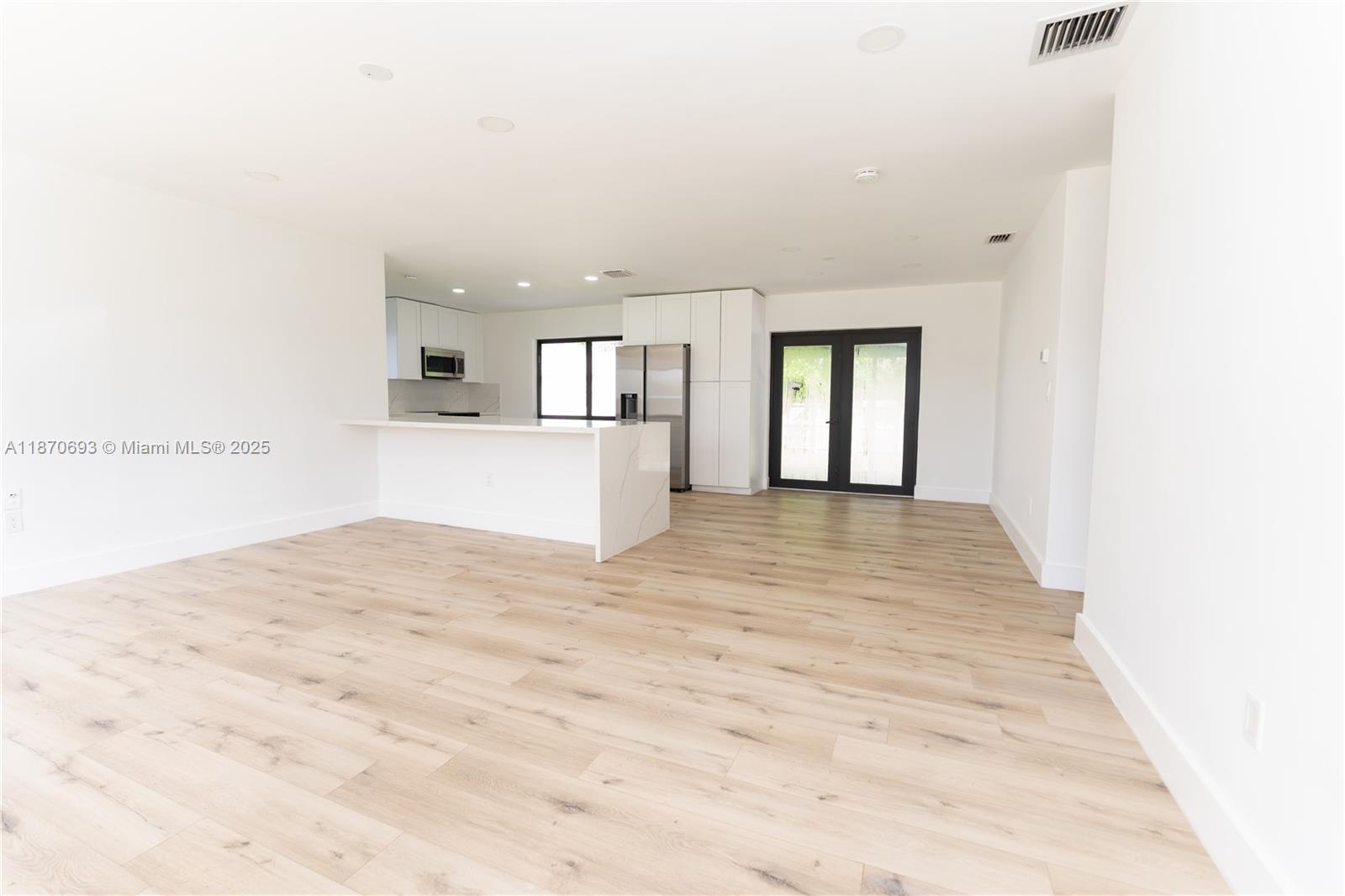 10441 Southwest 50th Terrace Miami, FL 33165 - Photo 5 of 19 a view of empty room with wooden floor