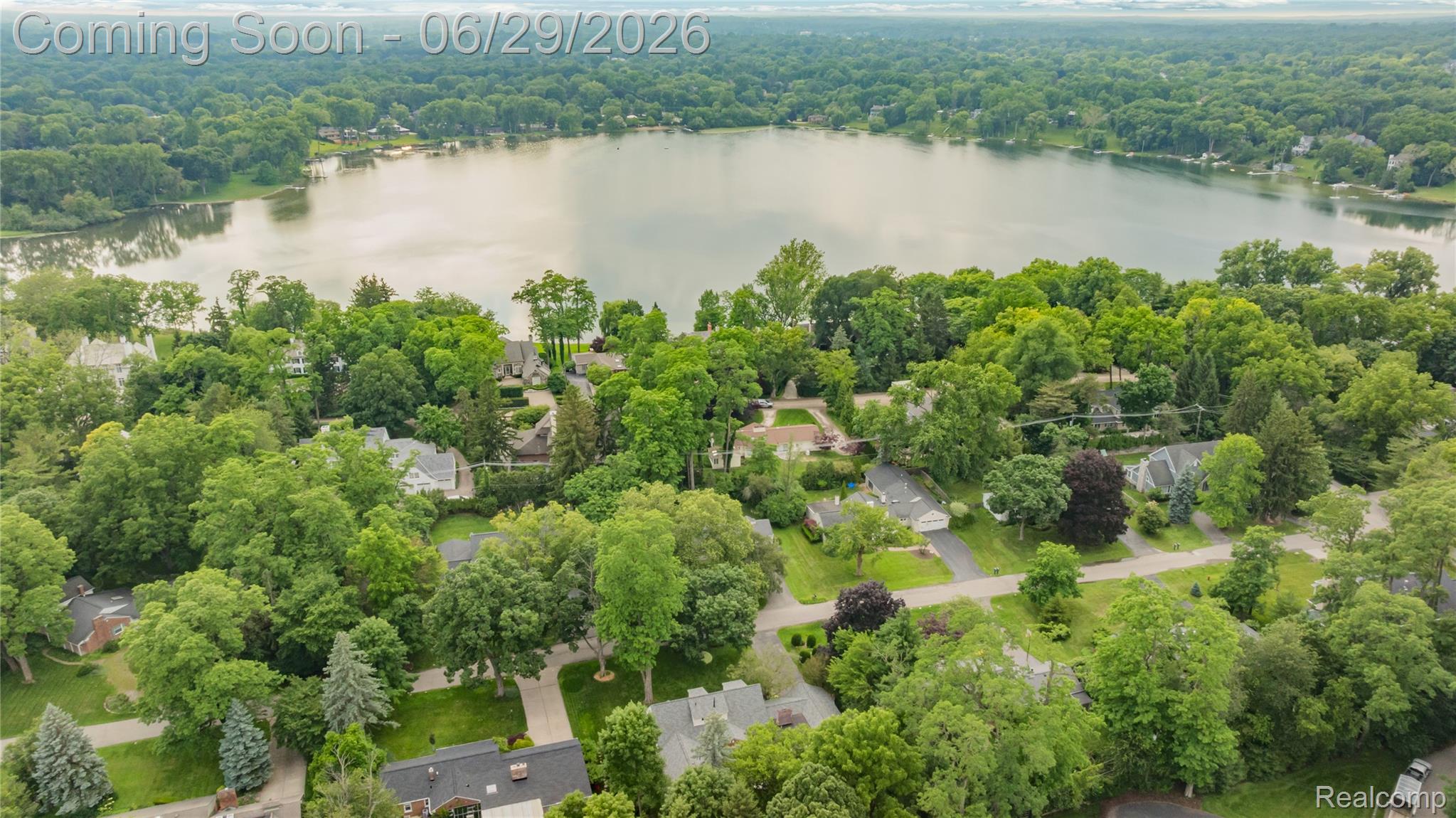 6085 Worlington Road Bloomfield Hills, MI 48301 - Photo 64 of 75 Expansive lake surrounded by a verdant landscape with extensive tree canopy
