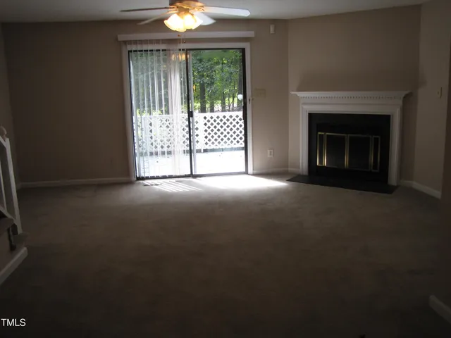 a view of an empty room with windows