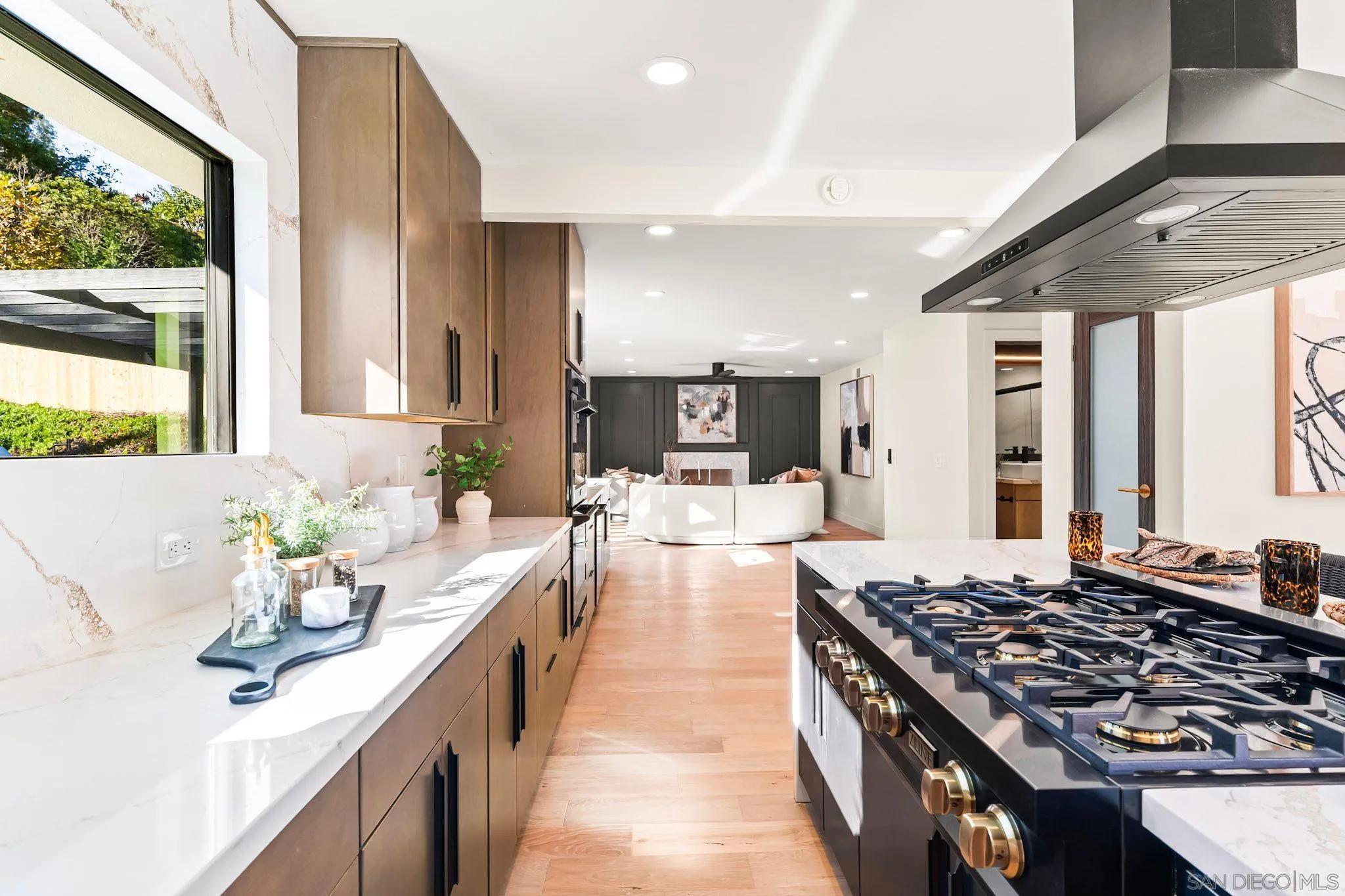 13334 Barbados Way Del Mar, CA 92014 - Photo 12 of 31 a large kitchen with kitchen island a large window in it