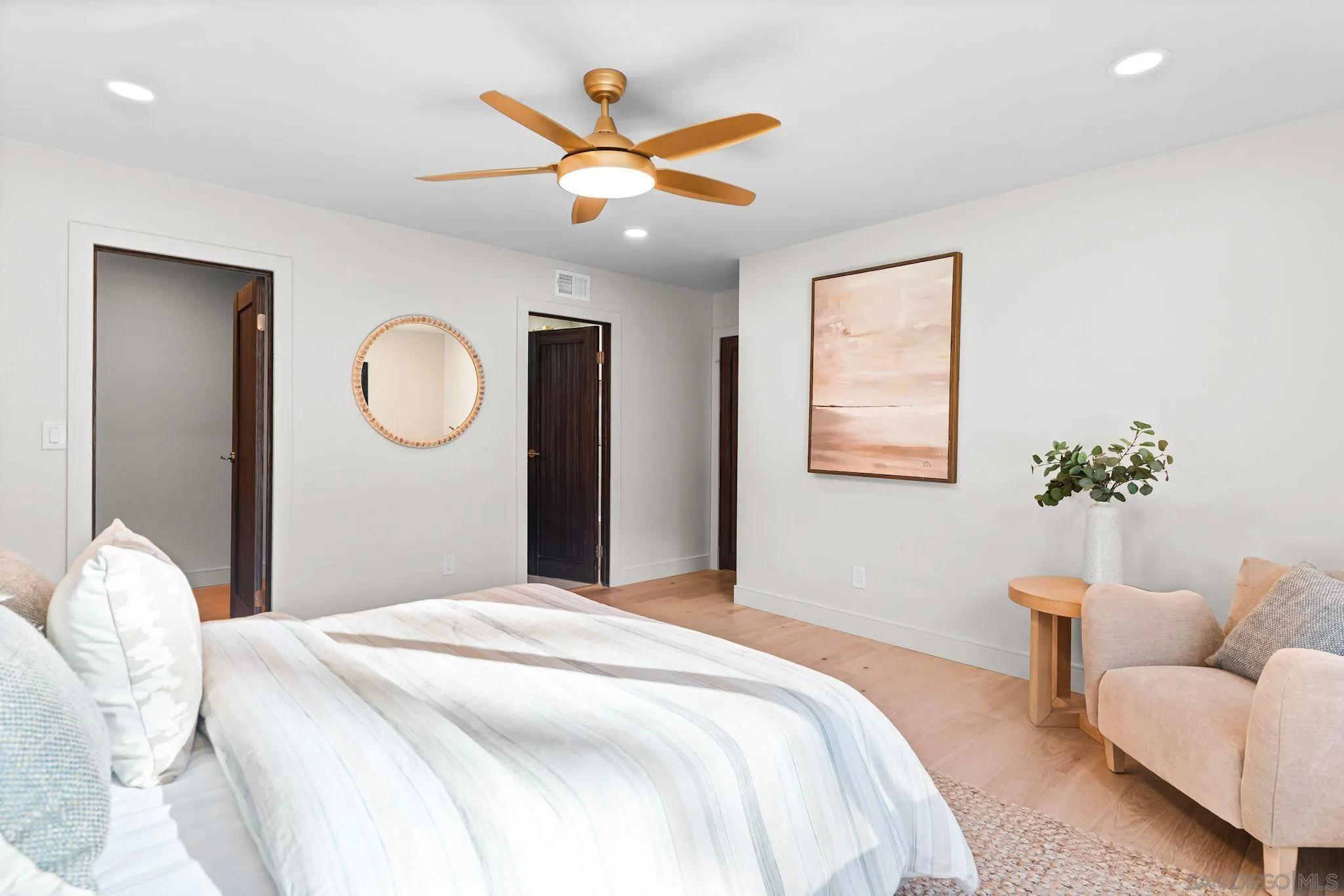 13334 Barbados Way Del Mar, CA 92014 - Photo 14 of 31 a bedroom with a large bed and a chandelier