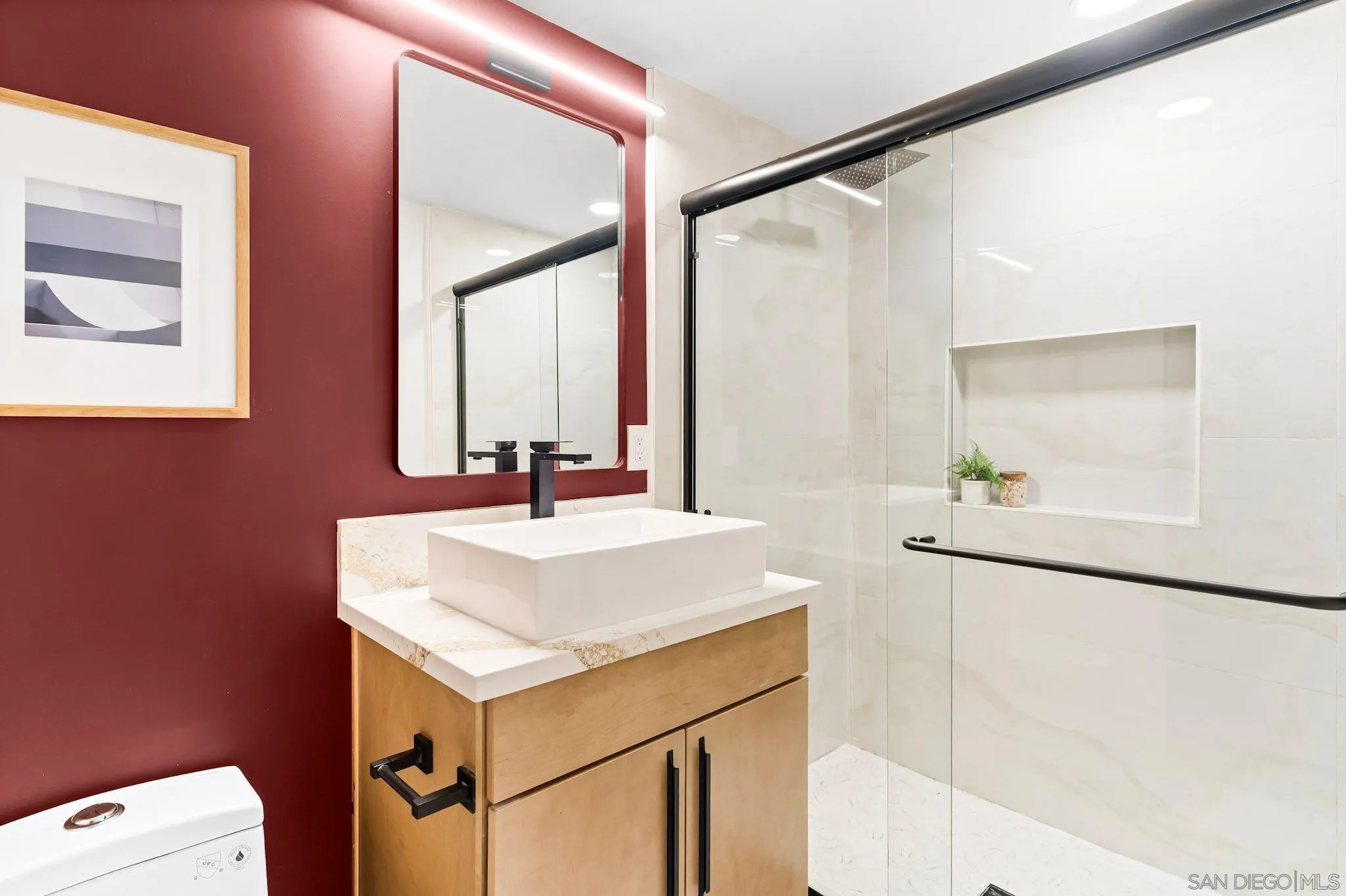13334 Barbados Way Del Mar, CA 92014 - Photo 22 of 31 a bathroom with a sink and a mirror