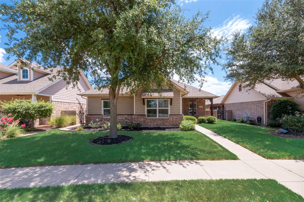 3318 Crystal Clear Court Granbury, TX 76049 - Photo 2 of 18 a front view of a house with garden