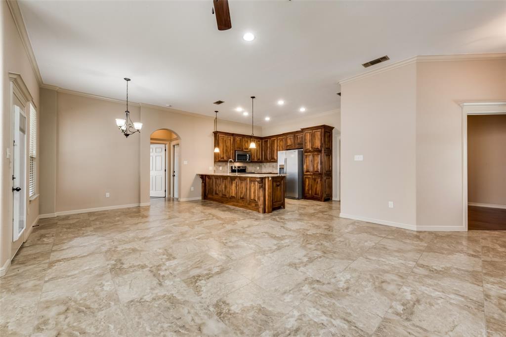 3318 Crystal Clear Court Granbury, TX 76049 - Photo 4 of 18 a view of a kitchen with a sink and cabinets