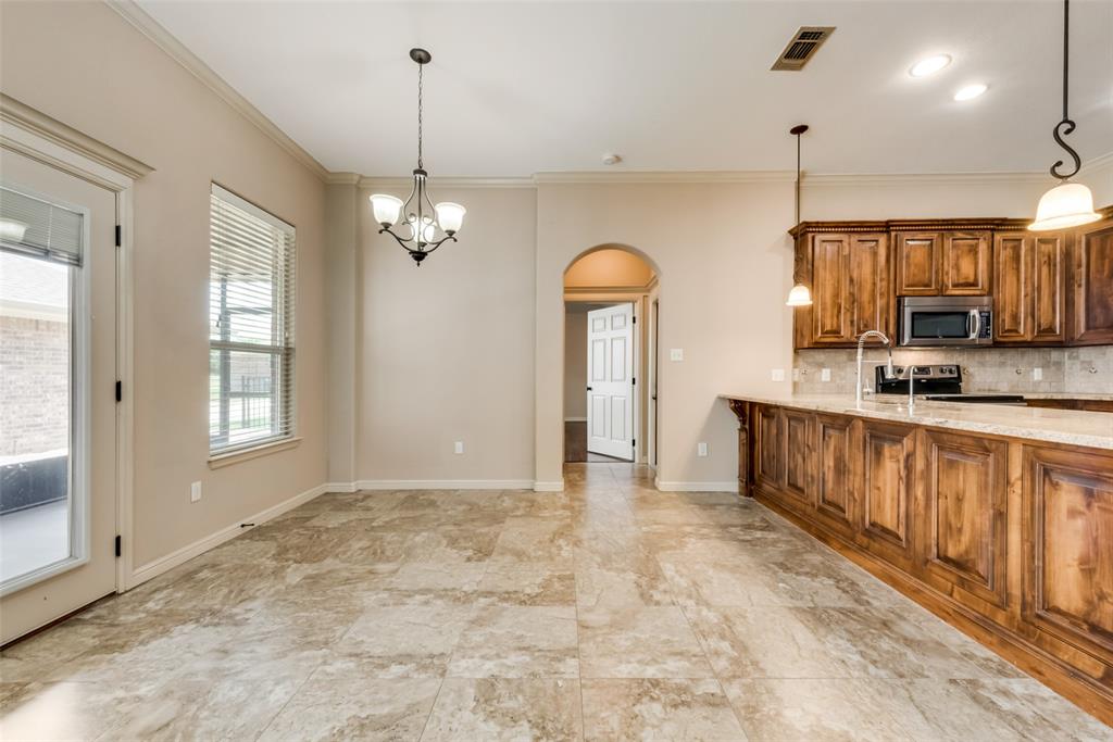 3318 Crystal Clear Court Granbury, TX 76049 - Photo 8 of 18 a view of a kitchen with a sink and a window