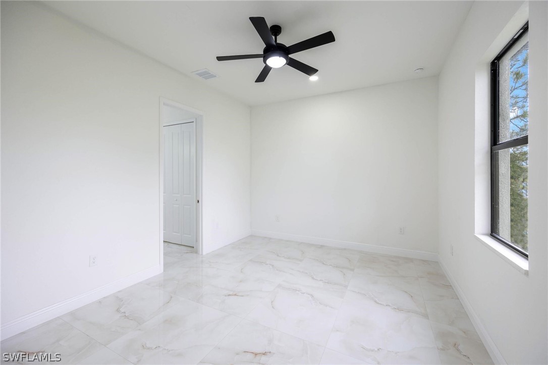 2909 37th Street Southwest Lehigh Acres, FL 33976 - Photo 16 of 29 an empty room