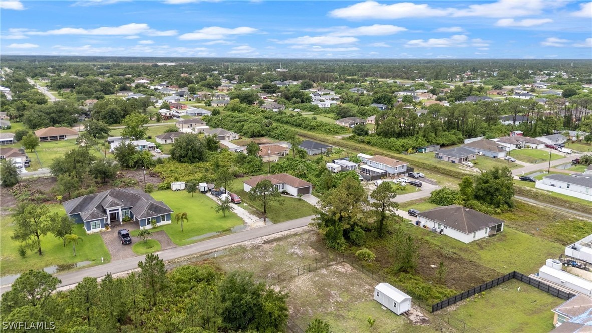 2909 37th Street Southwest Lehigh Acres, FL 33976 - Photo 28 of 29 an aerial view of residential houses with outdoor space