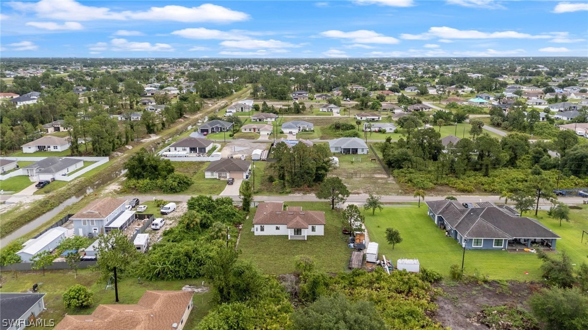 2909 37th Street Southwest Lehigh Acres, FL 33976 - Photo 29 of 29 an aerial view of residential houses with outdoor space and ocean view