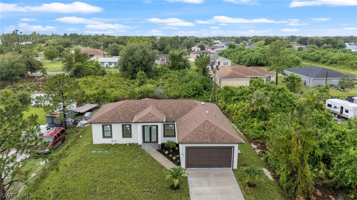 2909 37th Street Southwest Lehigh Acres, FL 33976 - Photo 4 of 29 an aerial view of a house