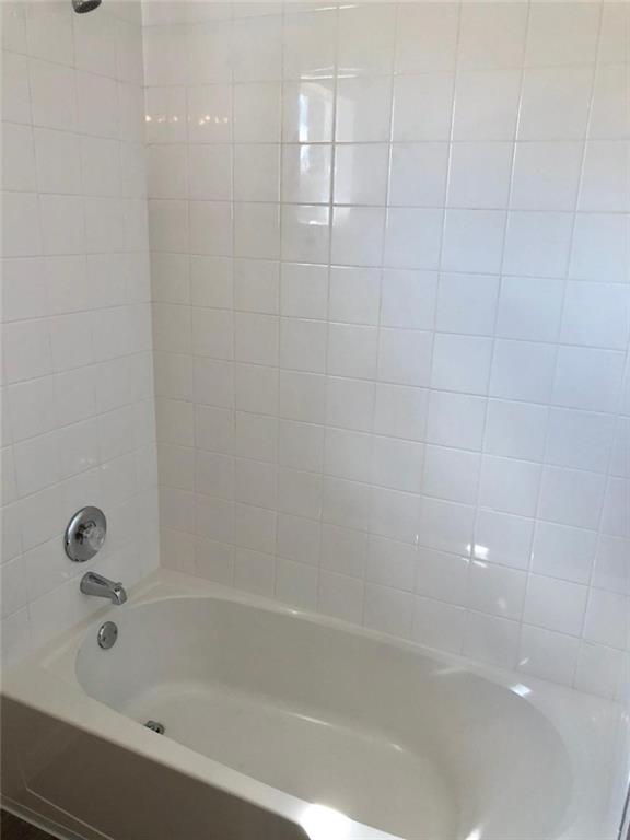 10801 Defender Trail Austin, TX 78754 - Photo 5 of 11 a bathroom with a bathtub