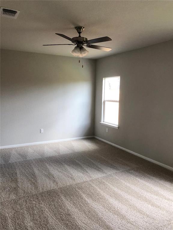 10801 Defender Trail Austin, TX 78754 - Photo 7 of 11 a view of a livingroom with a ceiling fan and window