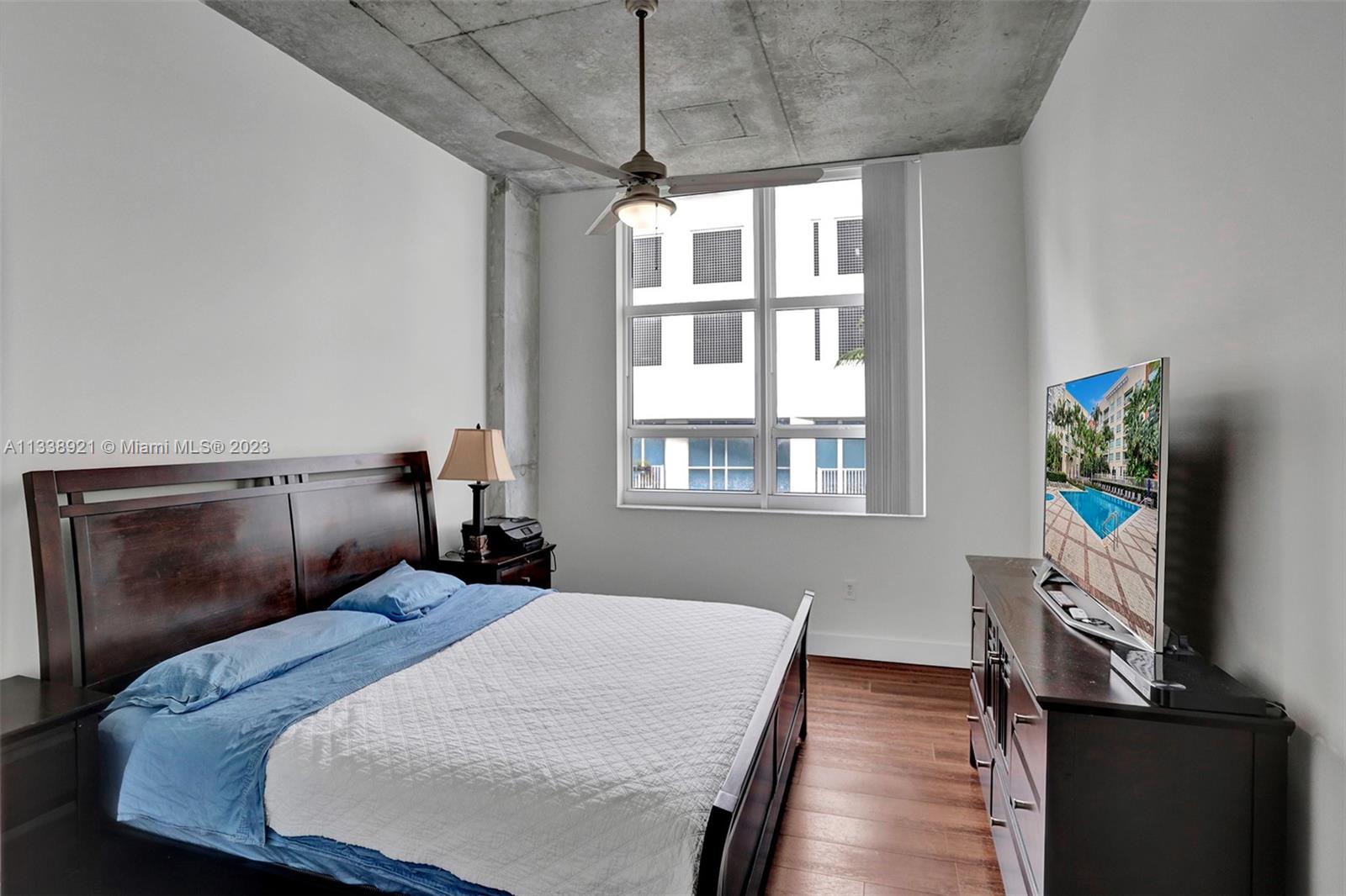 2001 Biscayne Boulevard, Unit 2202 Miami, FL 33137 - Photo 13 of 31 a bedroom with a bed and a window