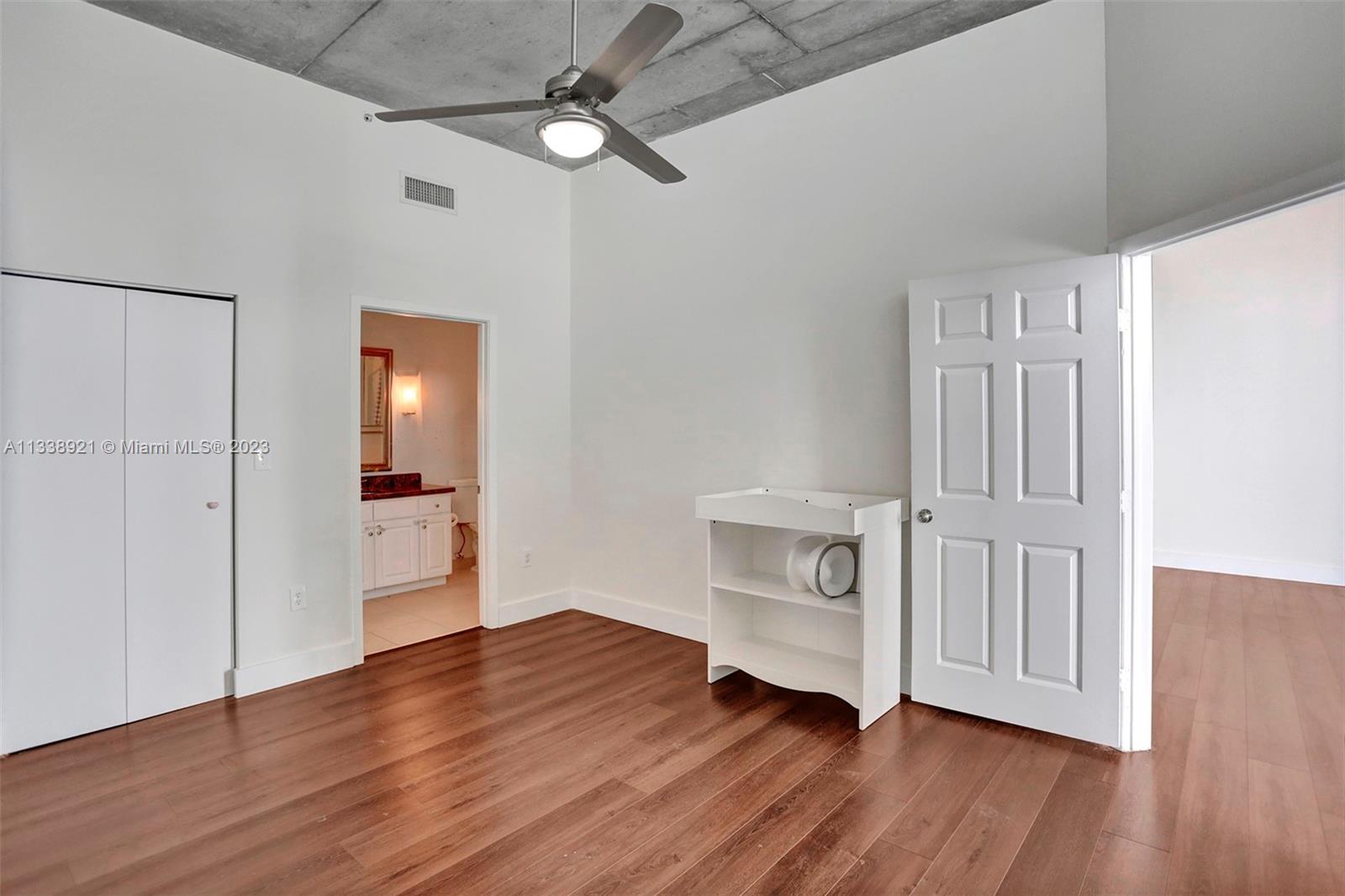 2001 Biscayne Boulevard, Unit 2202 Miami, FL 33137 - Photo 17 of 31 a view of an empty room and wooden floor