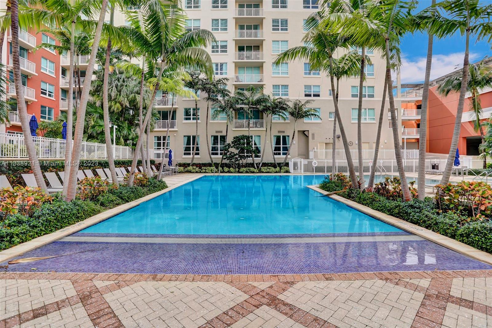 2001 Biscayne Boulevard, Unit 2202 Miami, FL 33137 - Photo 28 of 31 front view of building with a yard and potted plants